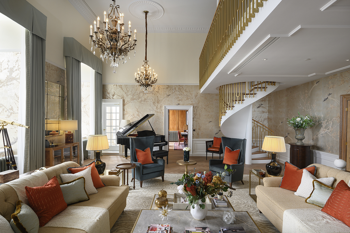 A bright drawing room with red cushions 