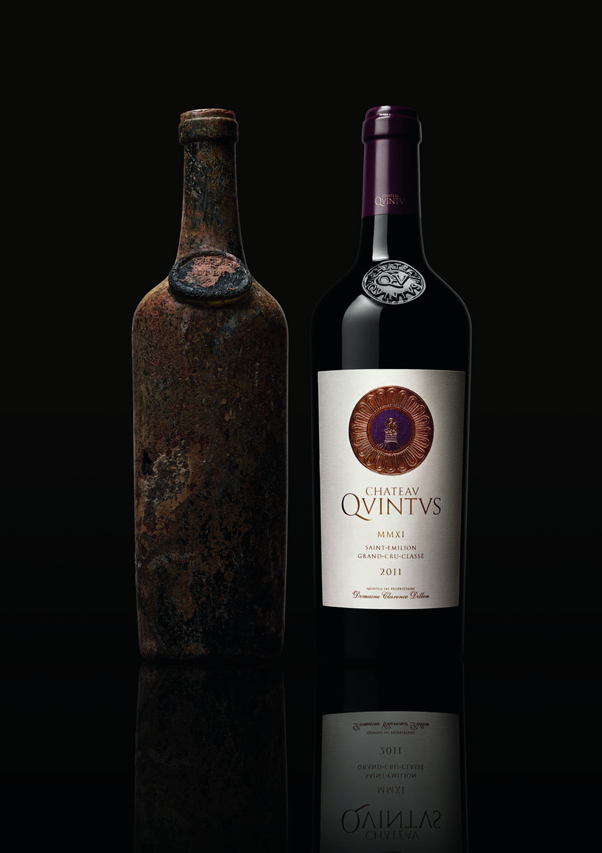 A contemporary bottle of wine and an antique bottle of wine 