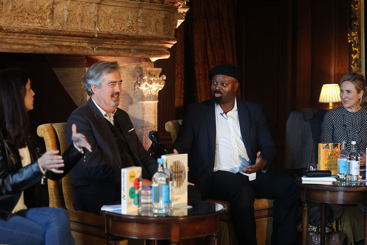 Merve Emre, Sebastian Barry, Ben Okri and Susie Boyt having a discussion by a fireplace