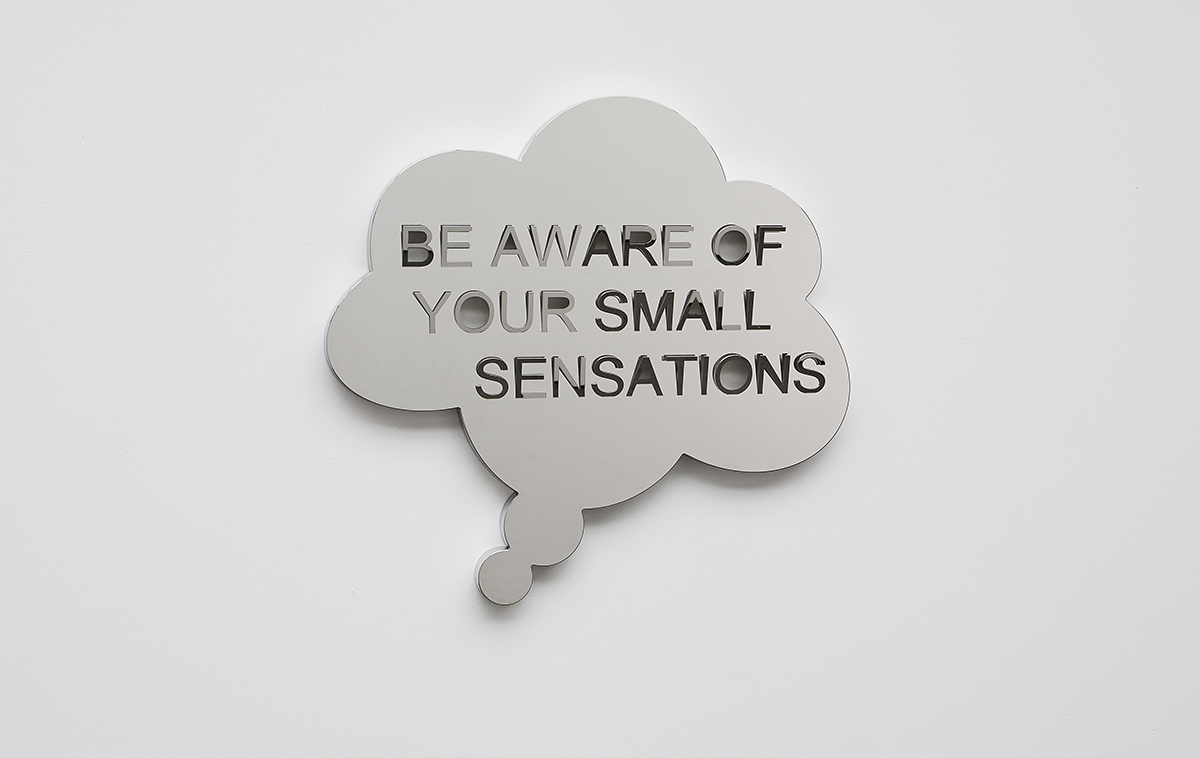 A mirror speech bubble that says 'Be aware of your small sensations"