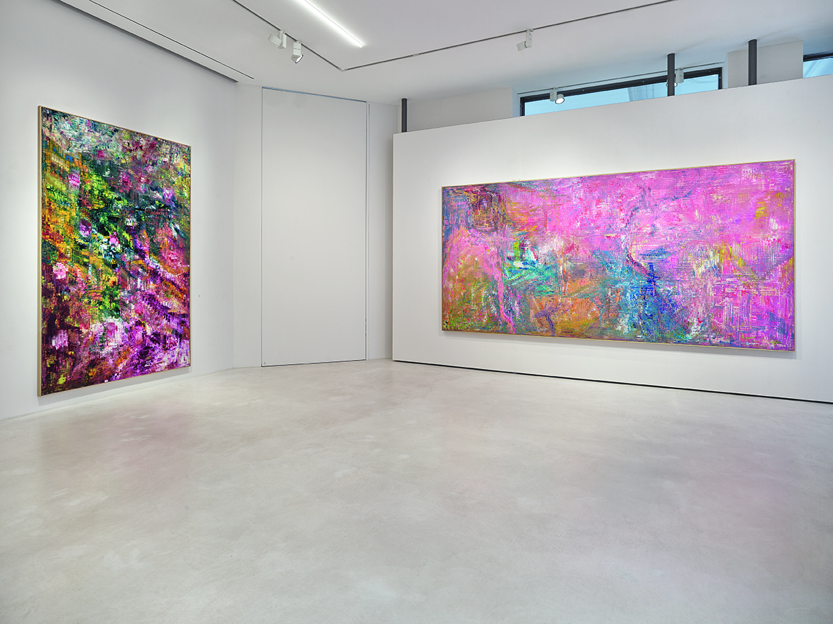 white walls with two pink paintings 