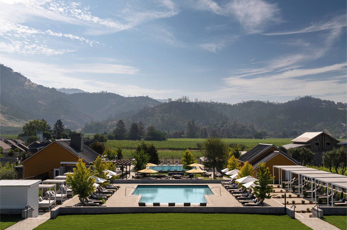 pool surrounded by hills and greenery