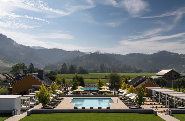 pool surrounded by hills and greenery