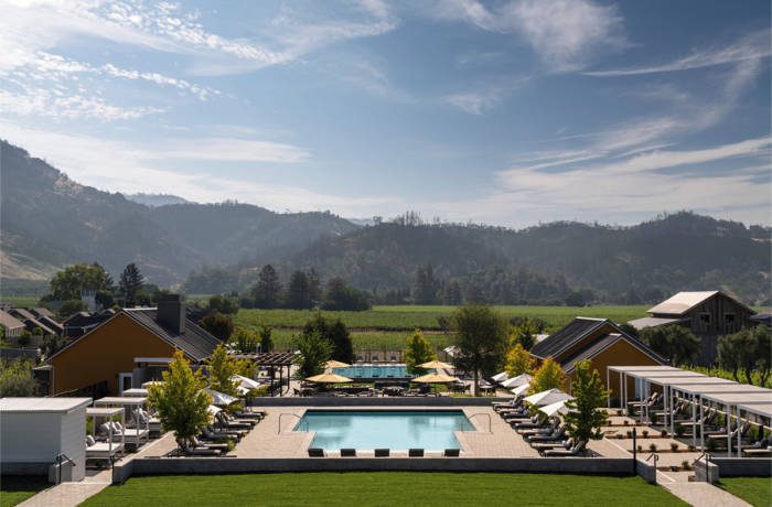 pool surrounded by hills and greenery