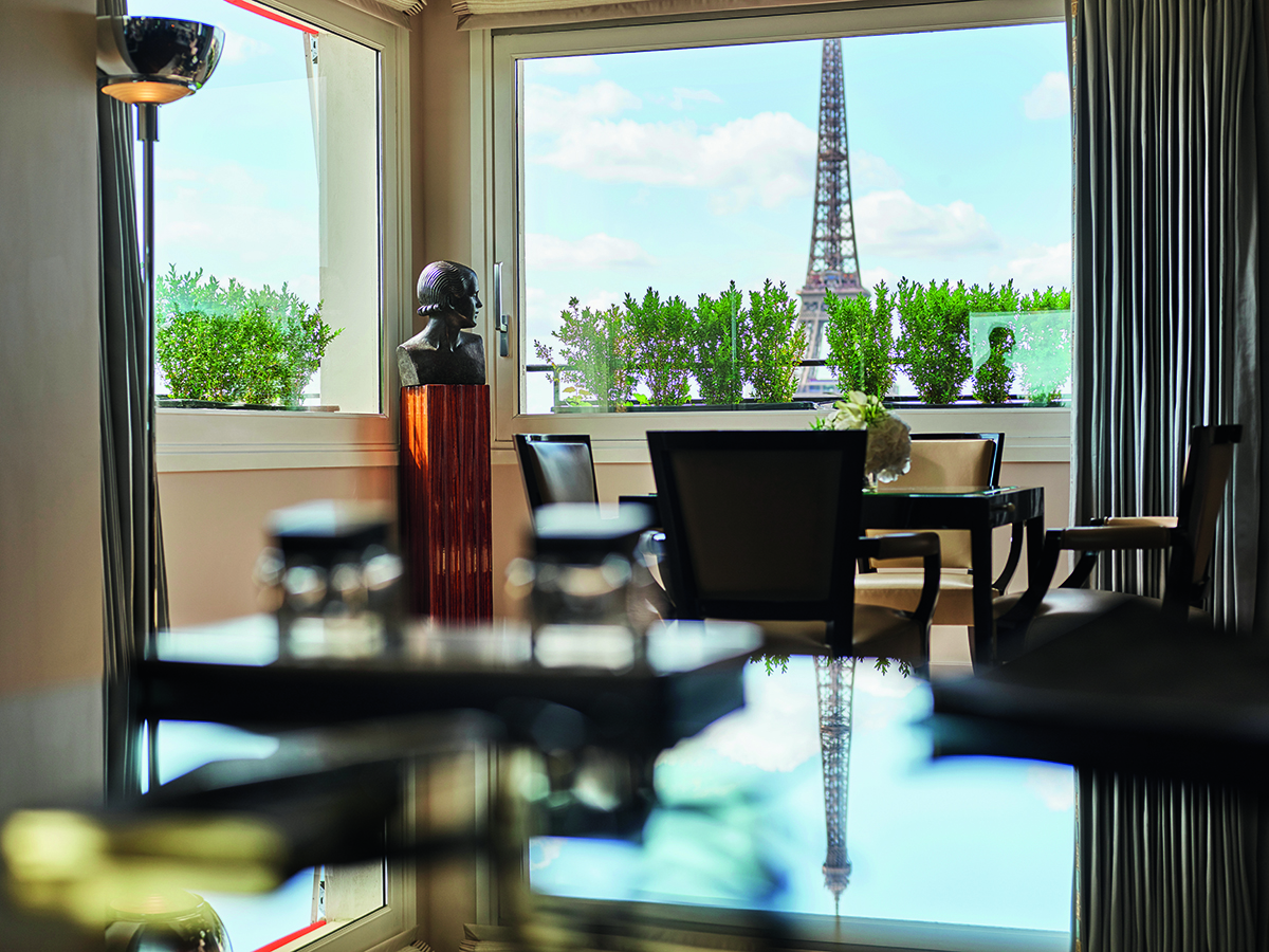 A lounge with a view of the Eiffel Tower out the window