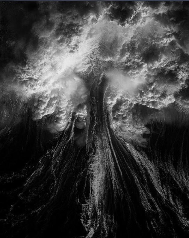waves crashing against each other in black and white