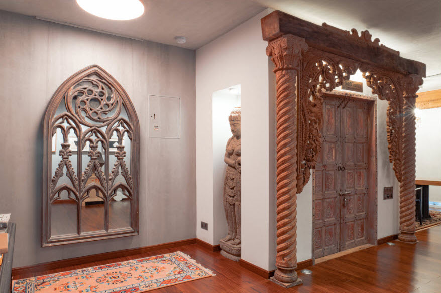 wood crafted sculptures and furniture in a room