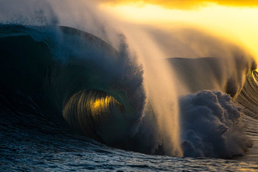 A wave crashing in to the sea