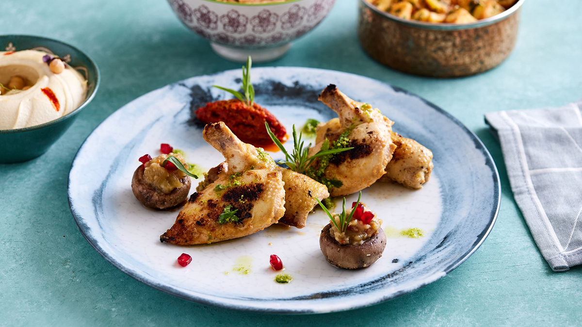 chicken on a plate with stuffed mushrooms