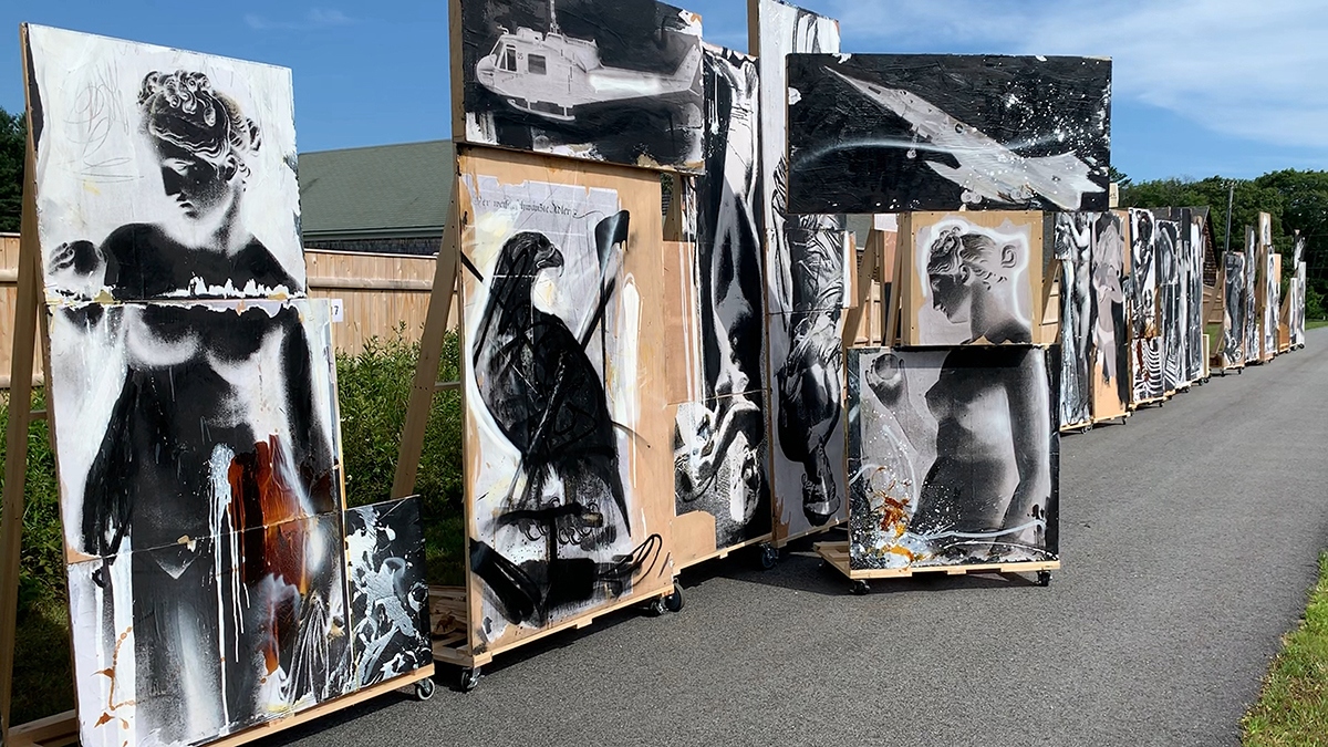 black and white paintings along a road