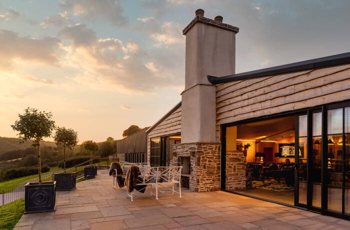 a stone house with an outdoor patio