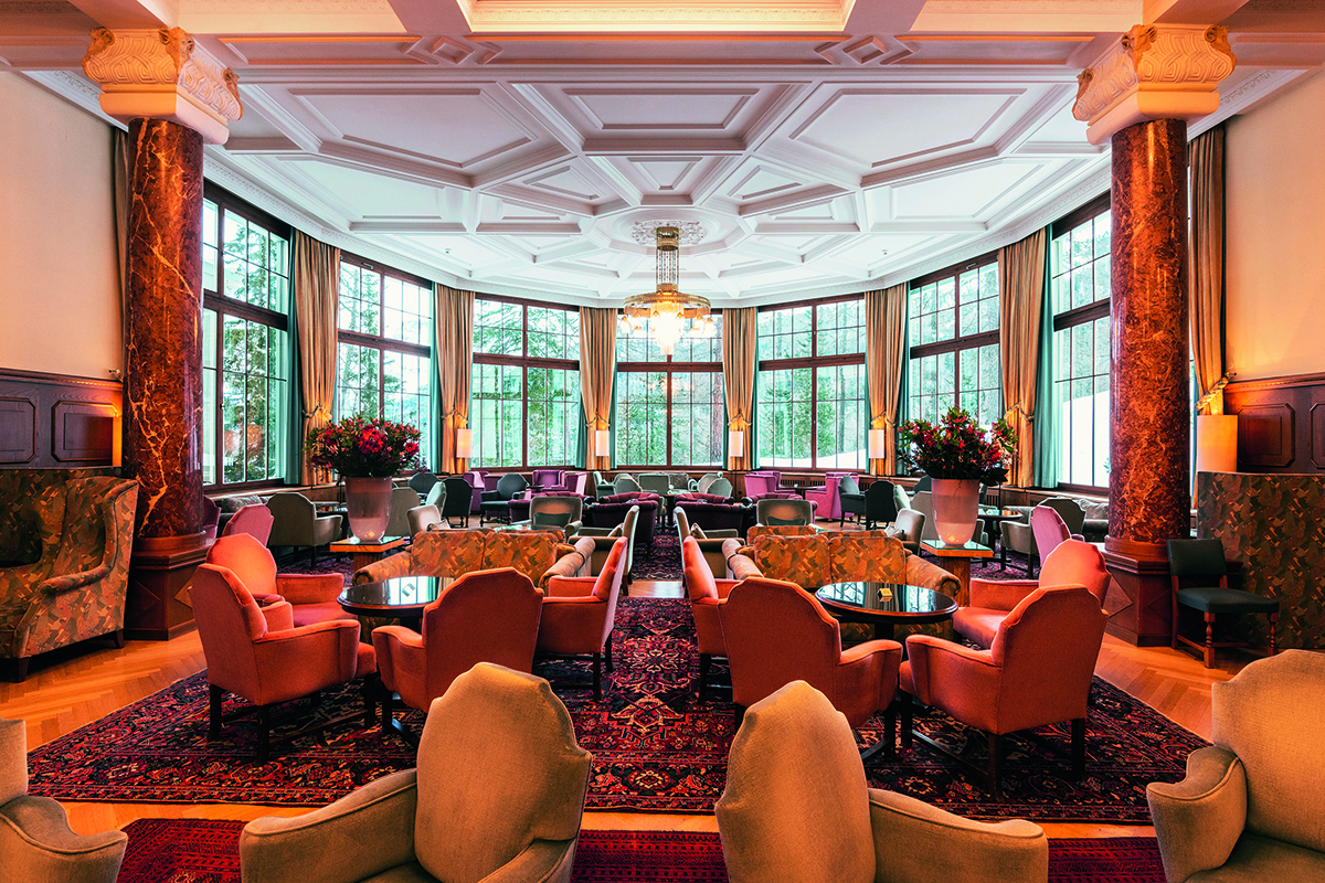 red and beige chairs in a room with windows