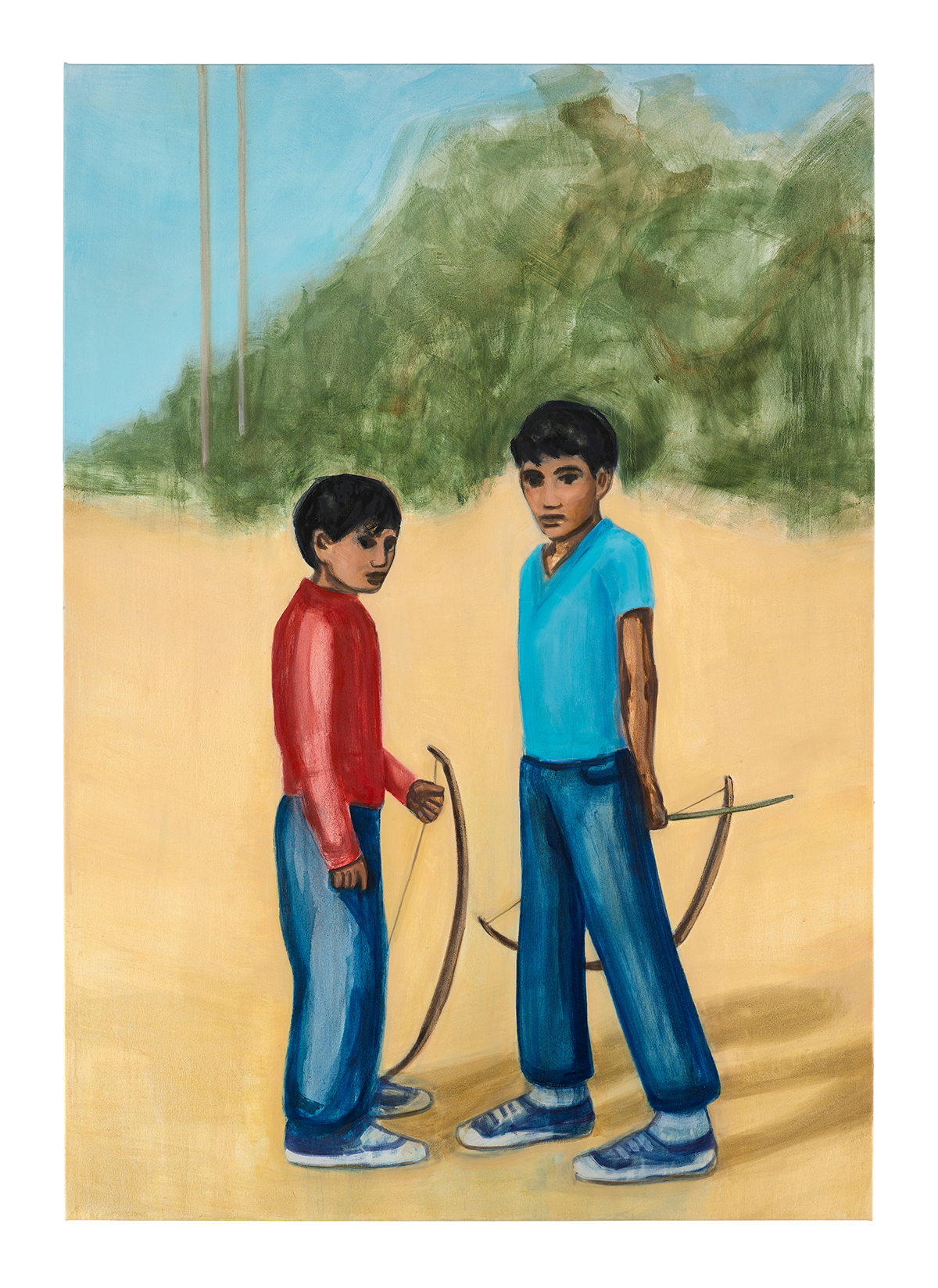 Two boys standing in red and bleu tops and jeans holding archery bows