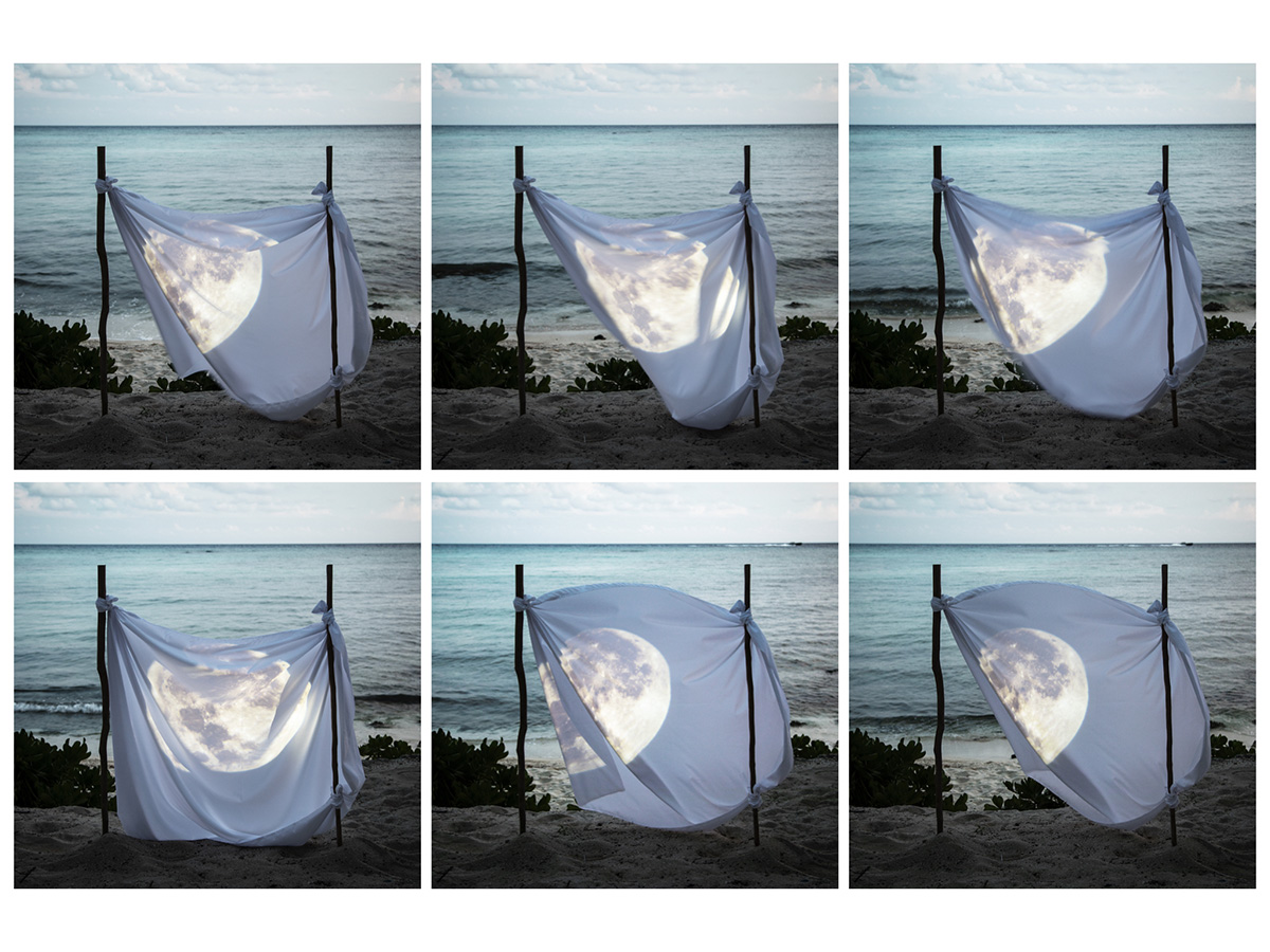The moon on a sheet hung up on the beach