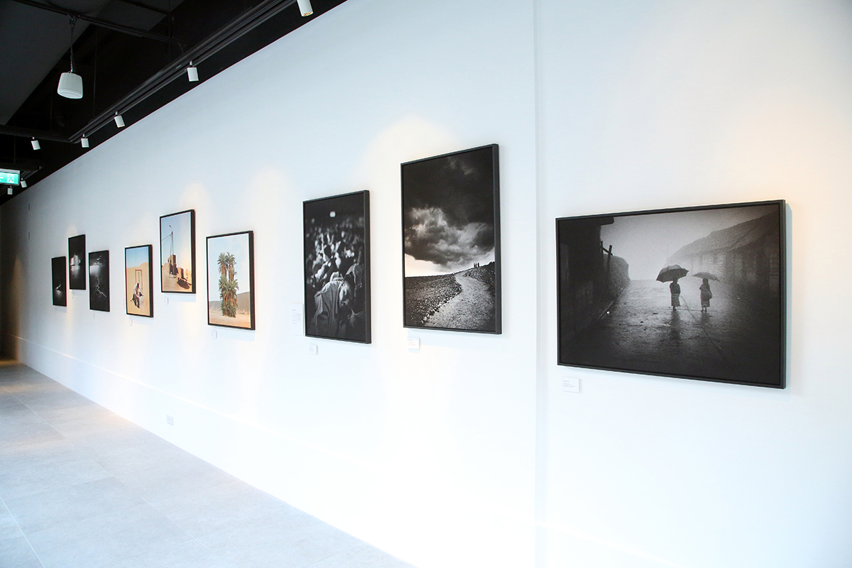 an art gallery with photographs on the wall