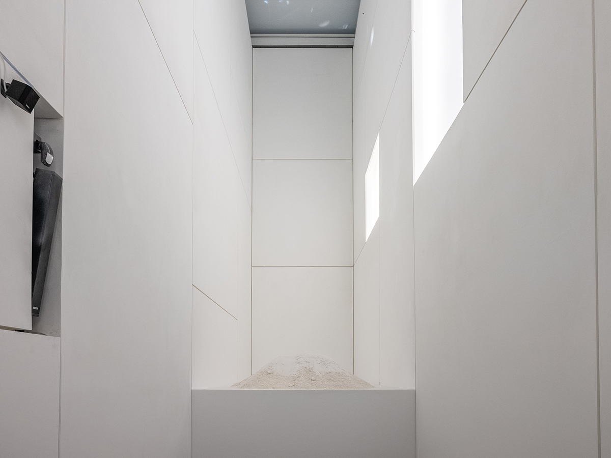 A white room with light coming through a window
