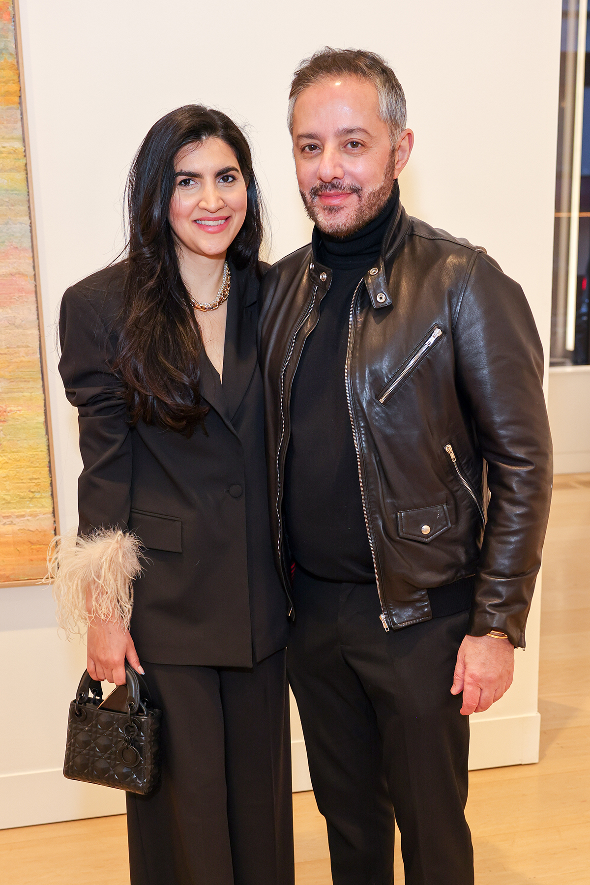 A man and woman wearing black outfits