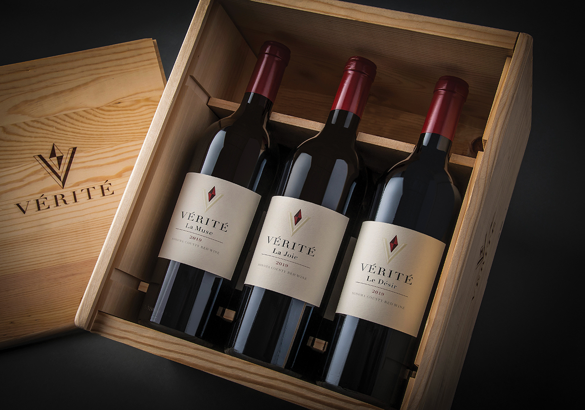 Three bottles of wine in a wooden box