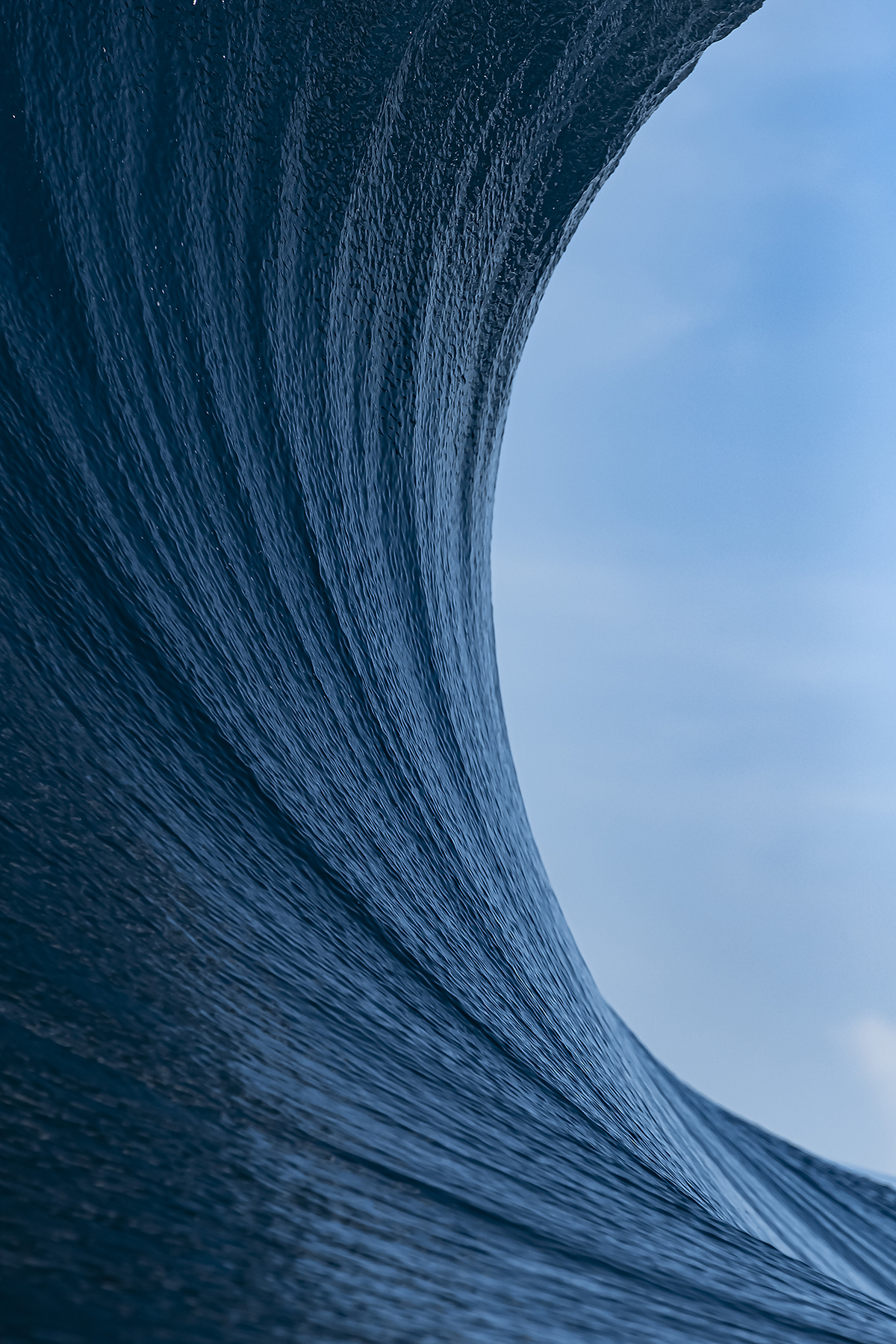 The curve of a wave and the blue sky