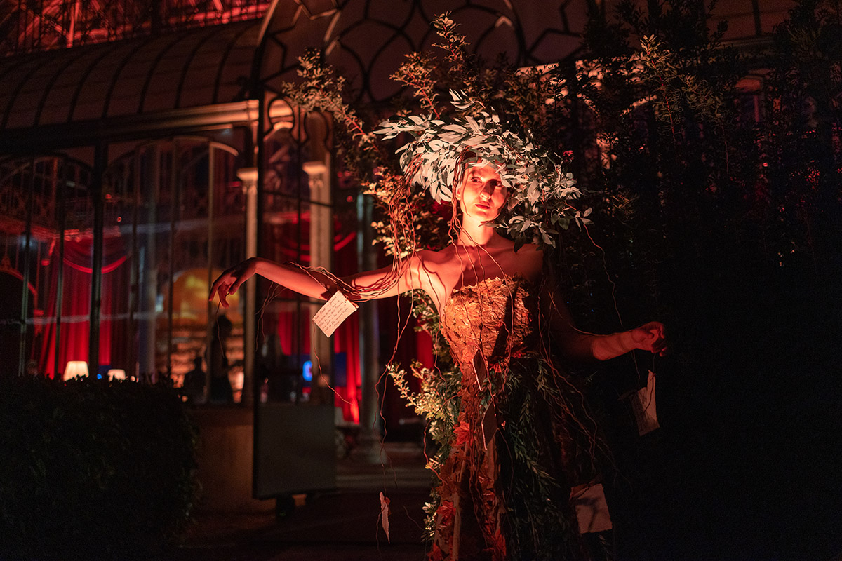 A woman wearing leaves