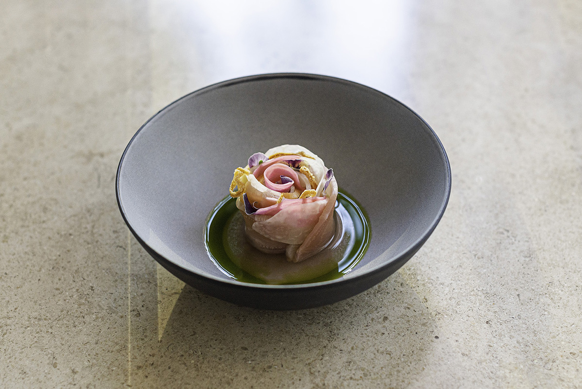 A fish dish in the shape of a pink rose