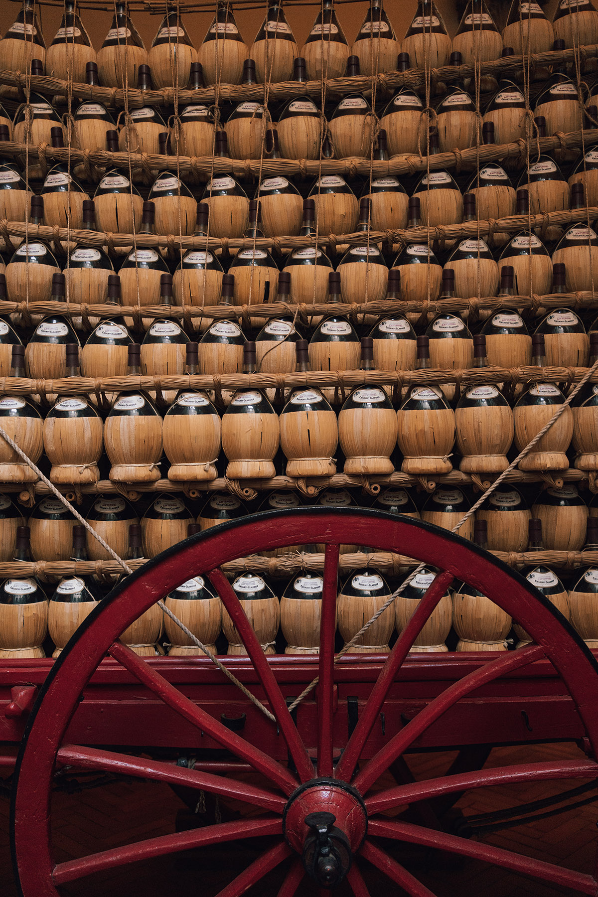 cases of wine and a red wheel