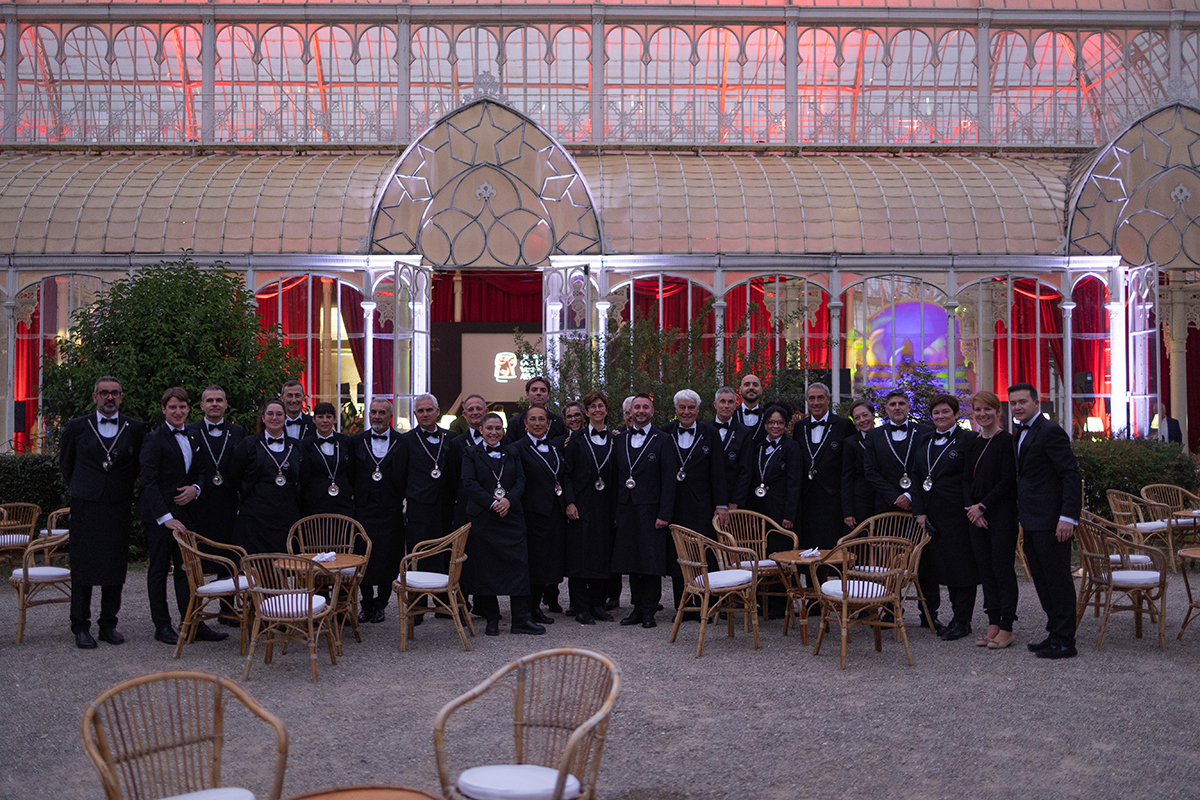 people standing outside a conservatory in uniform