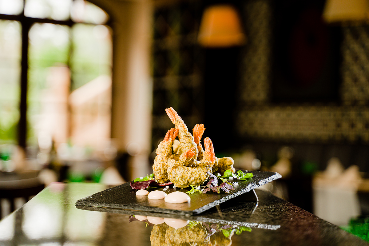 Fried shrimp on a black plate