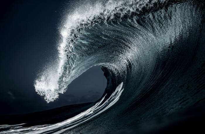 A wave crashing into the sea