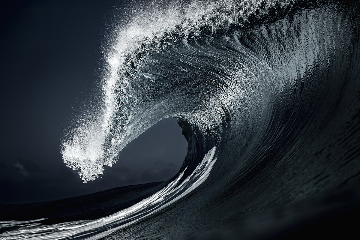 A wave crashing into the sea