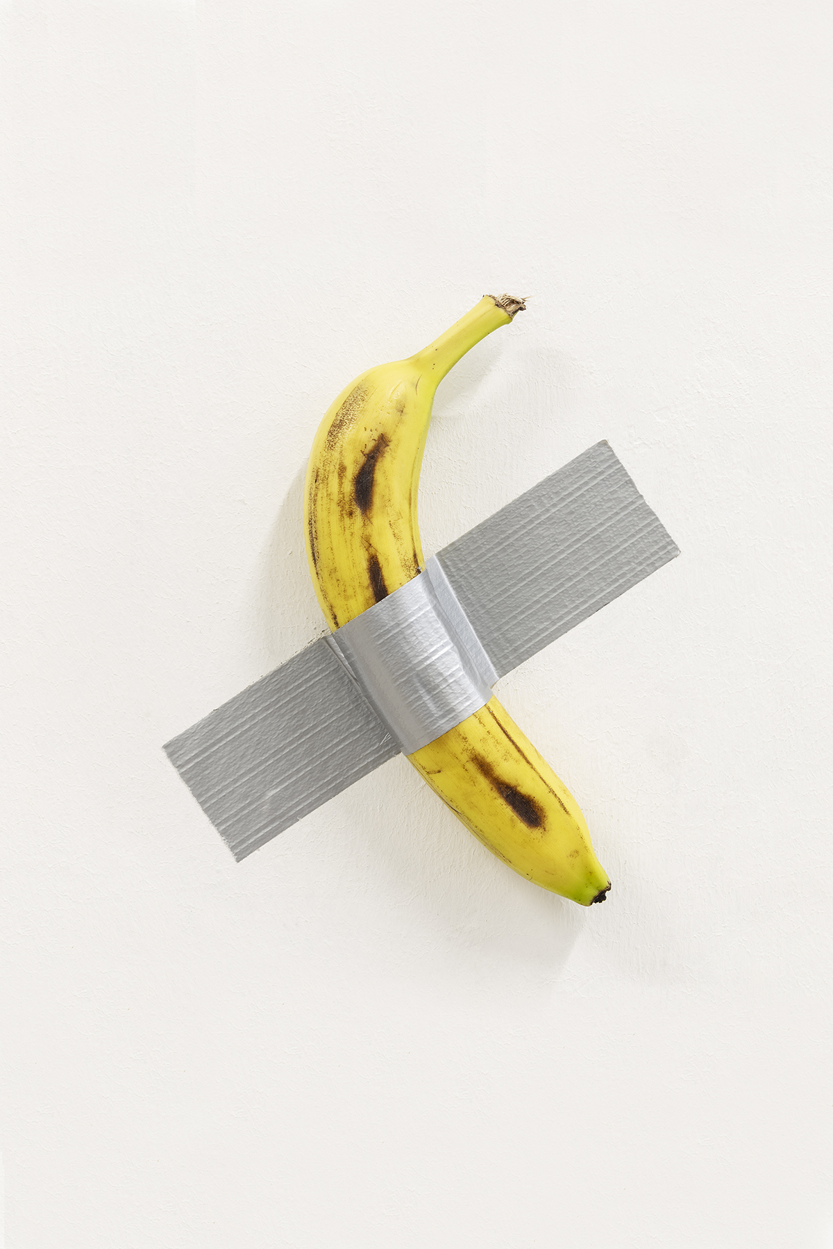 A banana taped to the wall