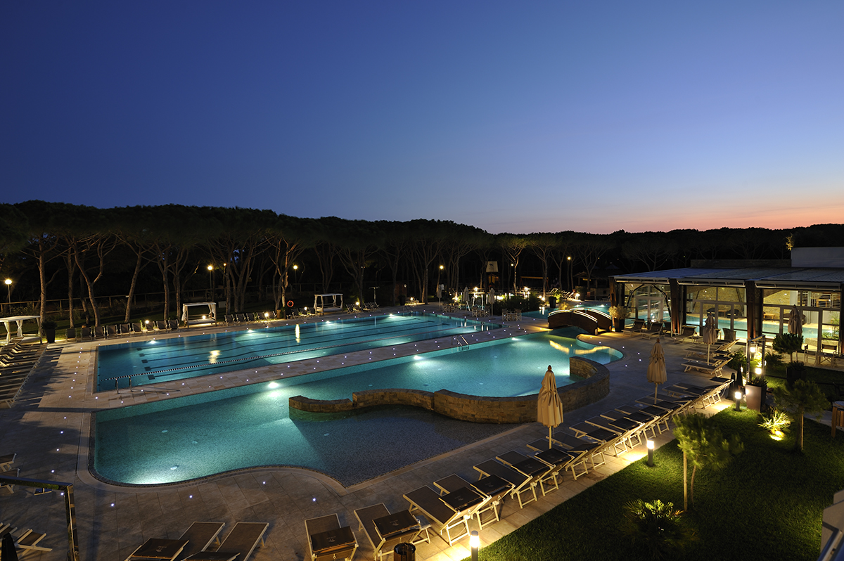 A swimming pool lit up a night