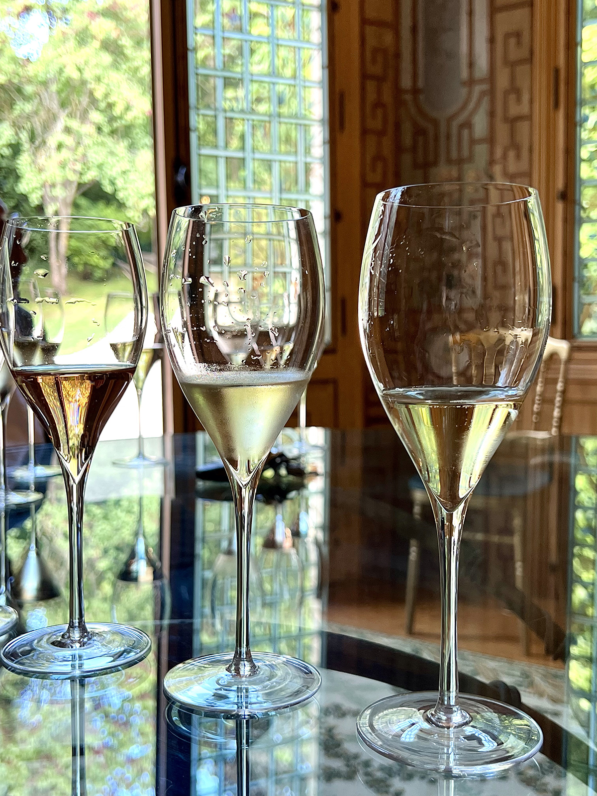 three wine glasses on a table