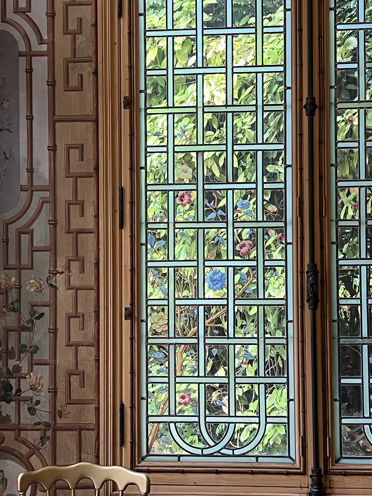 A window with flowers behind it
