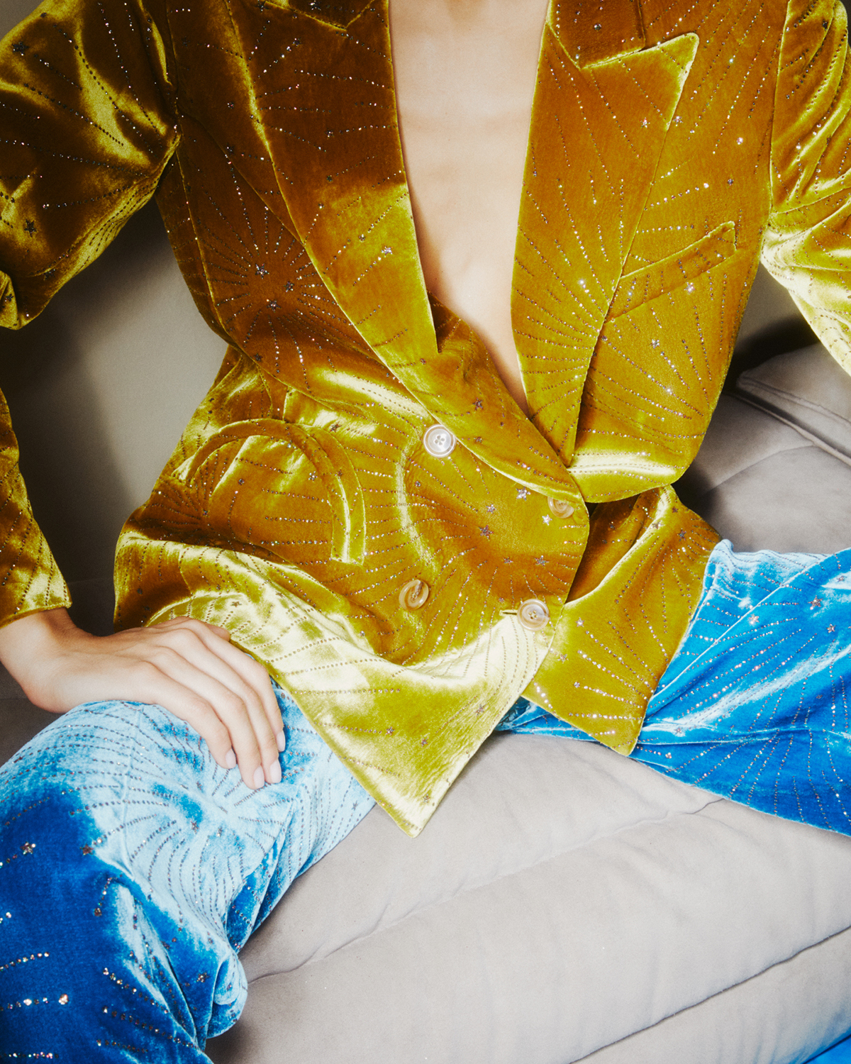 Sparkly yellow velvet jacket and blue trousers photographed by a digital camera