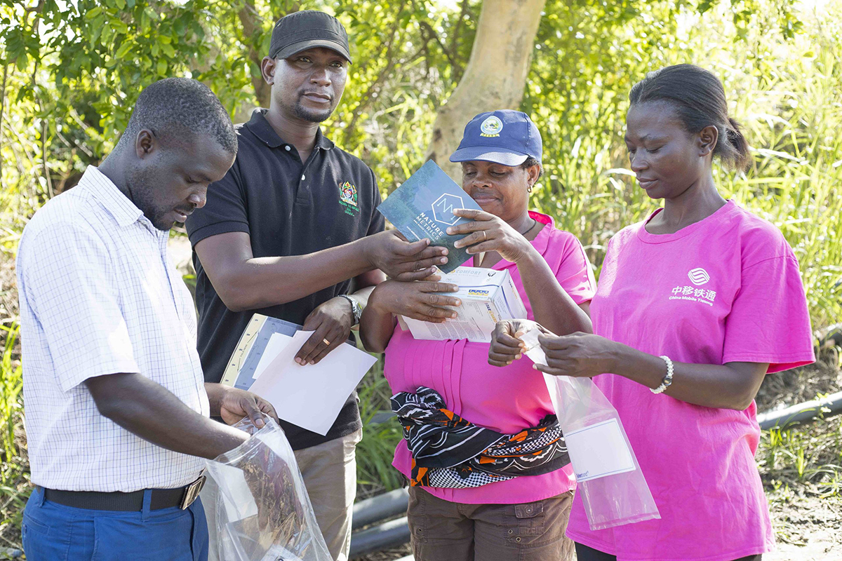 people standing together weather pink t-shirts