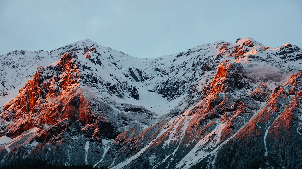 Mountain scene with run rising against the rocks