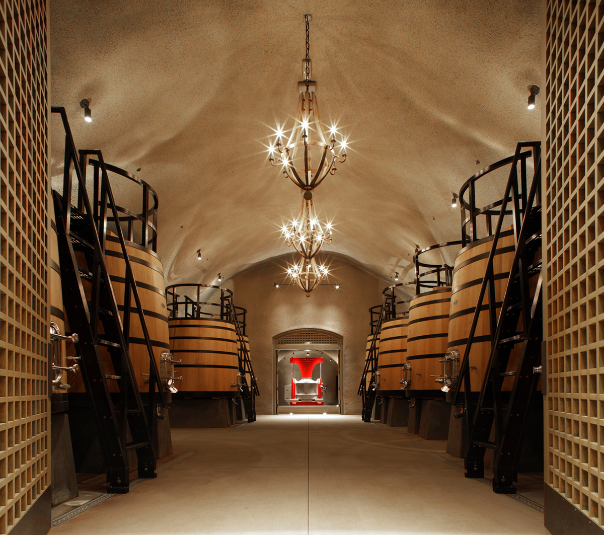 casks in a room with a chandelier