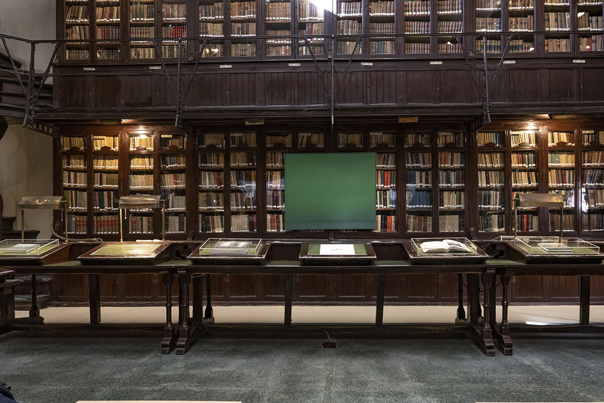 books in glass boxes in a library