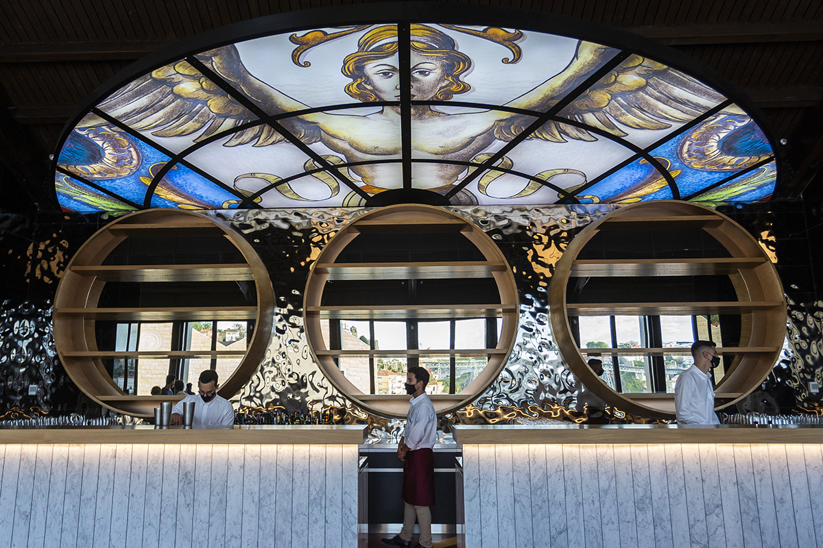 A bar with a decorated ceilings