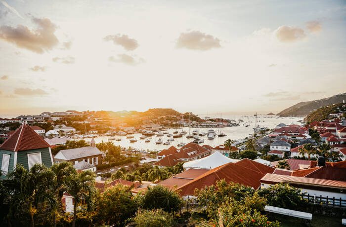 A coastal town with red roofed houses