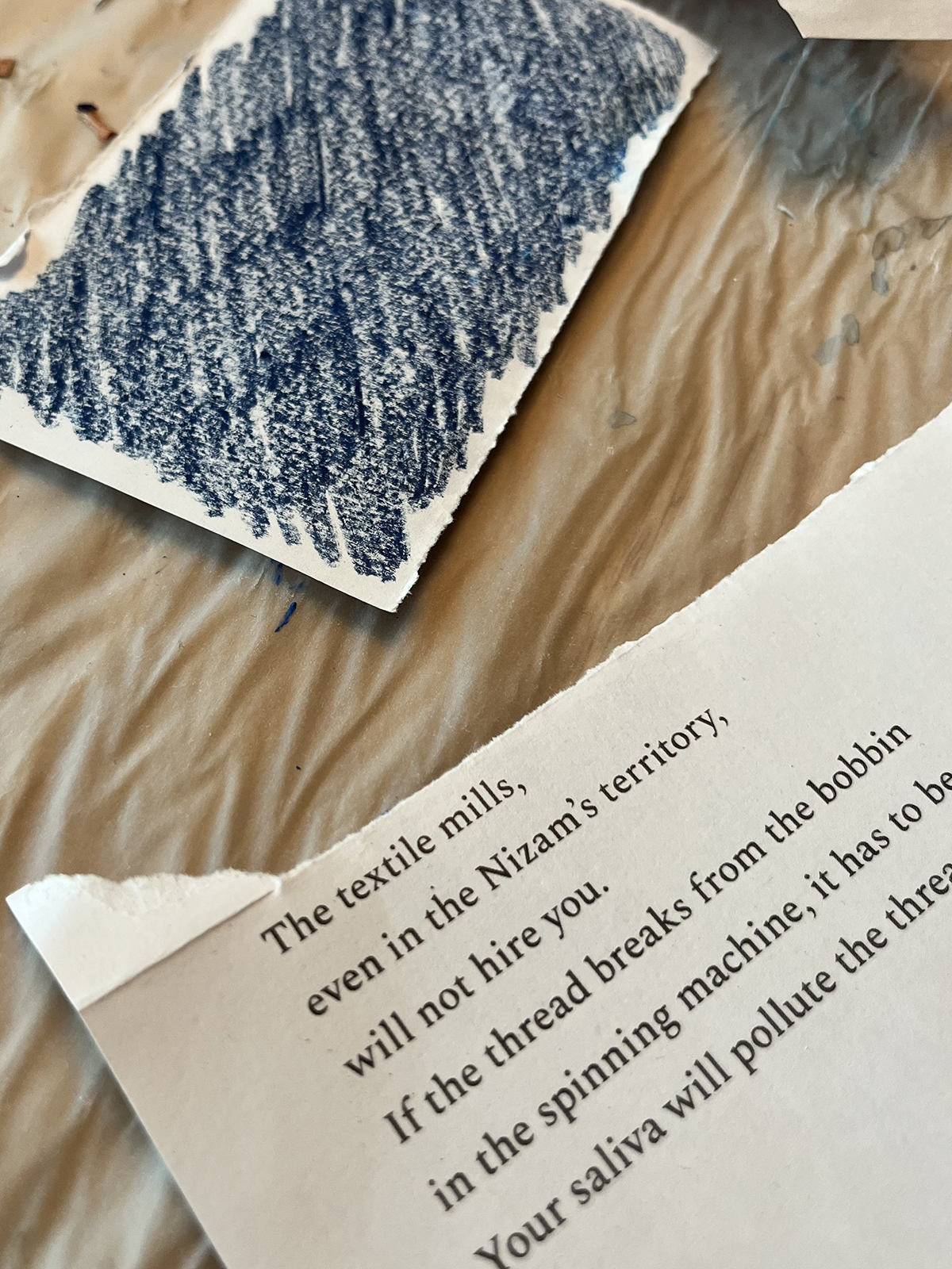 A poem next to a paper coloured in blue