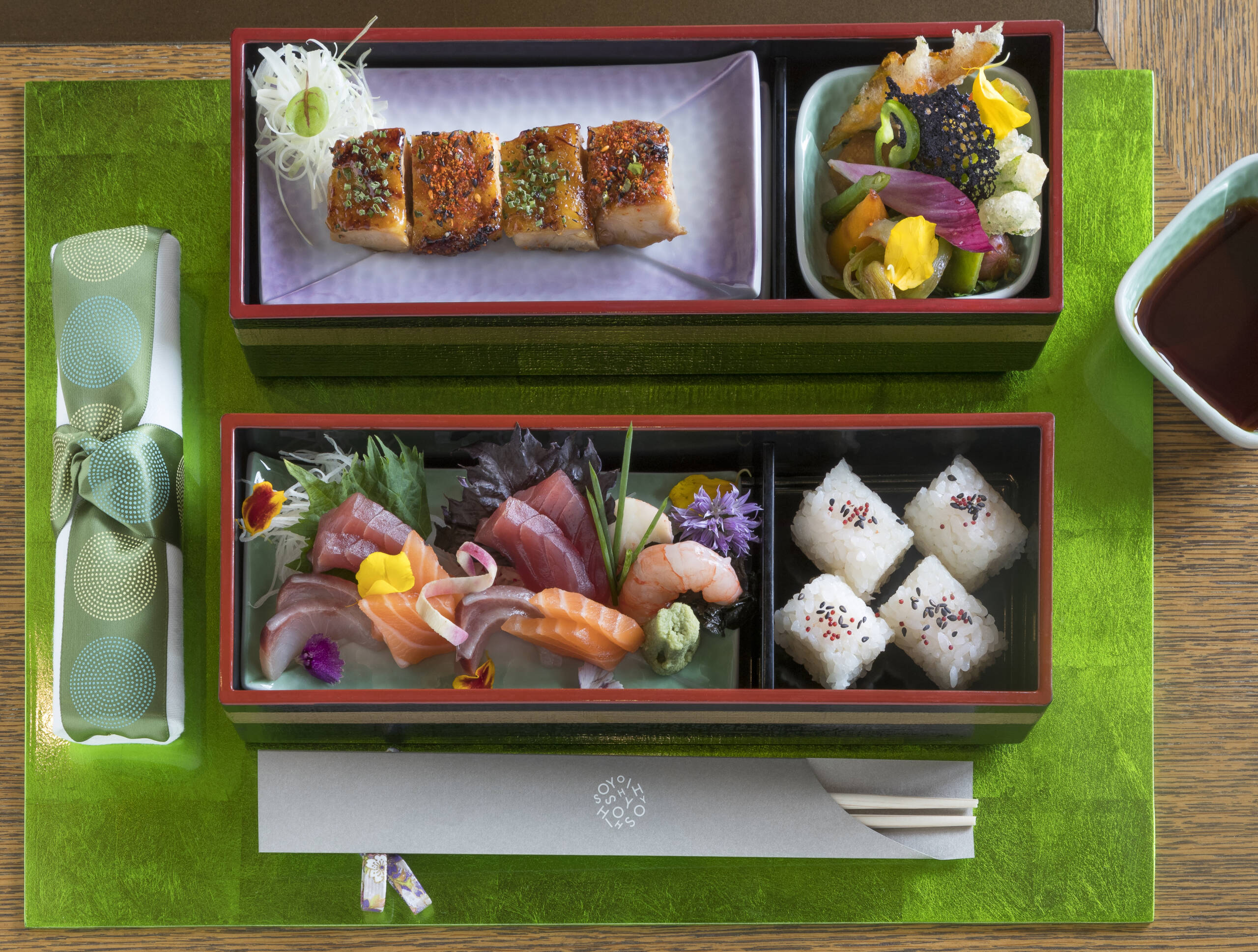 Carefully arranged bento bowl on a green placemat