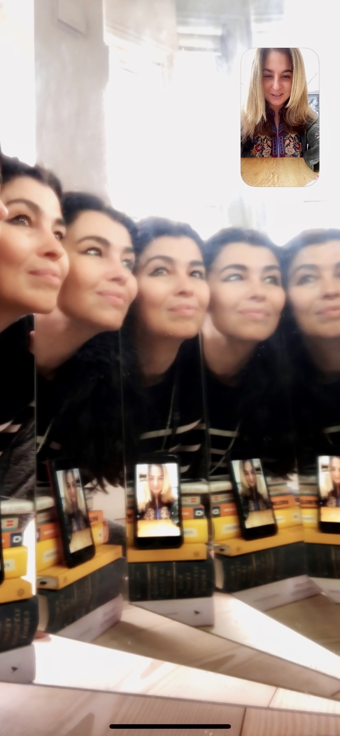 Screenshot of a woman in multiple mirrors