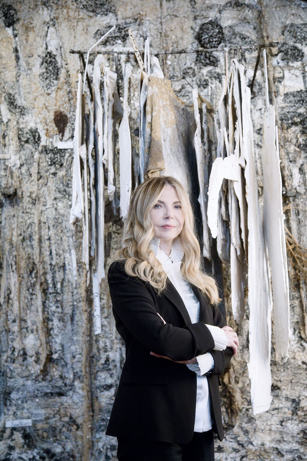 Woman standing in front of artwork