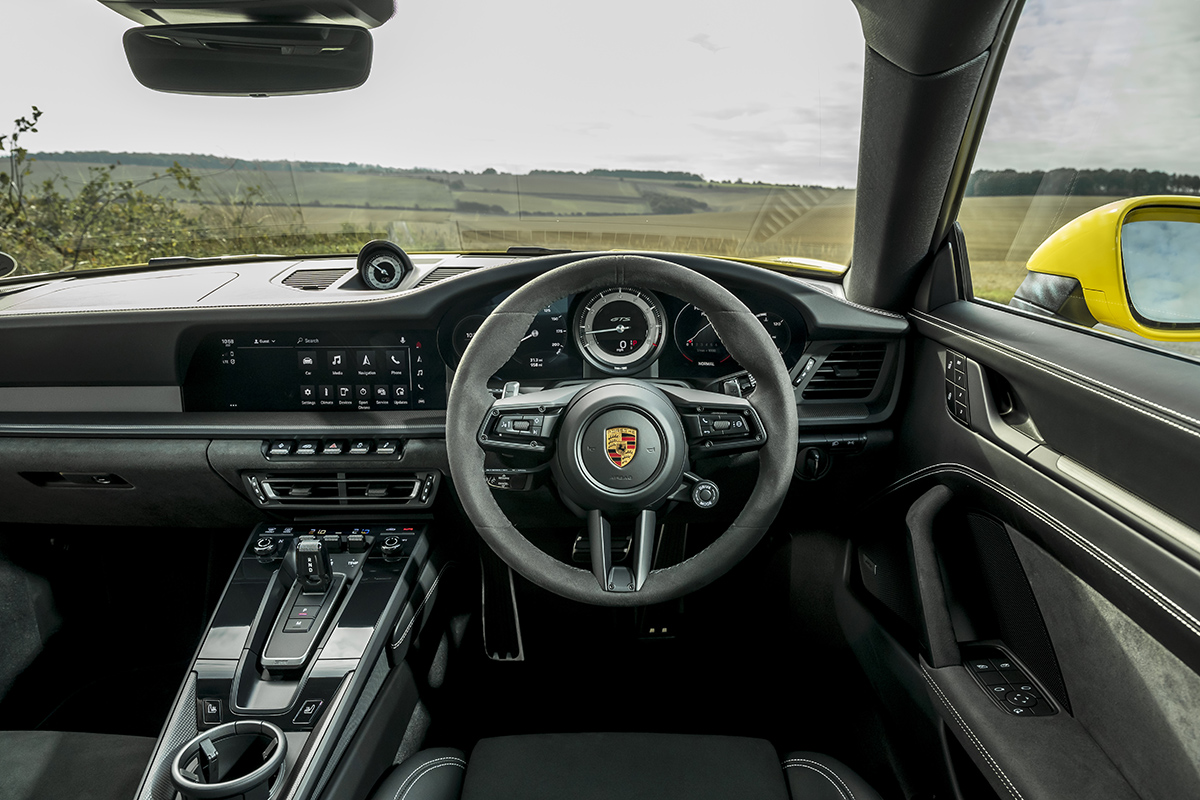 The steering wheel and controls inside a Porsche 911 GTS