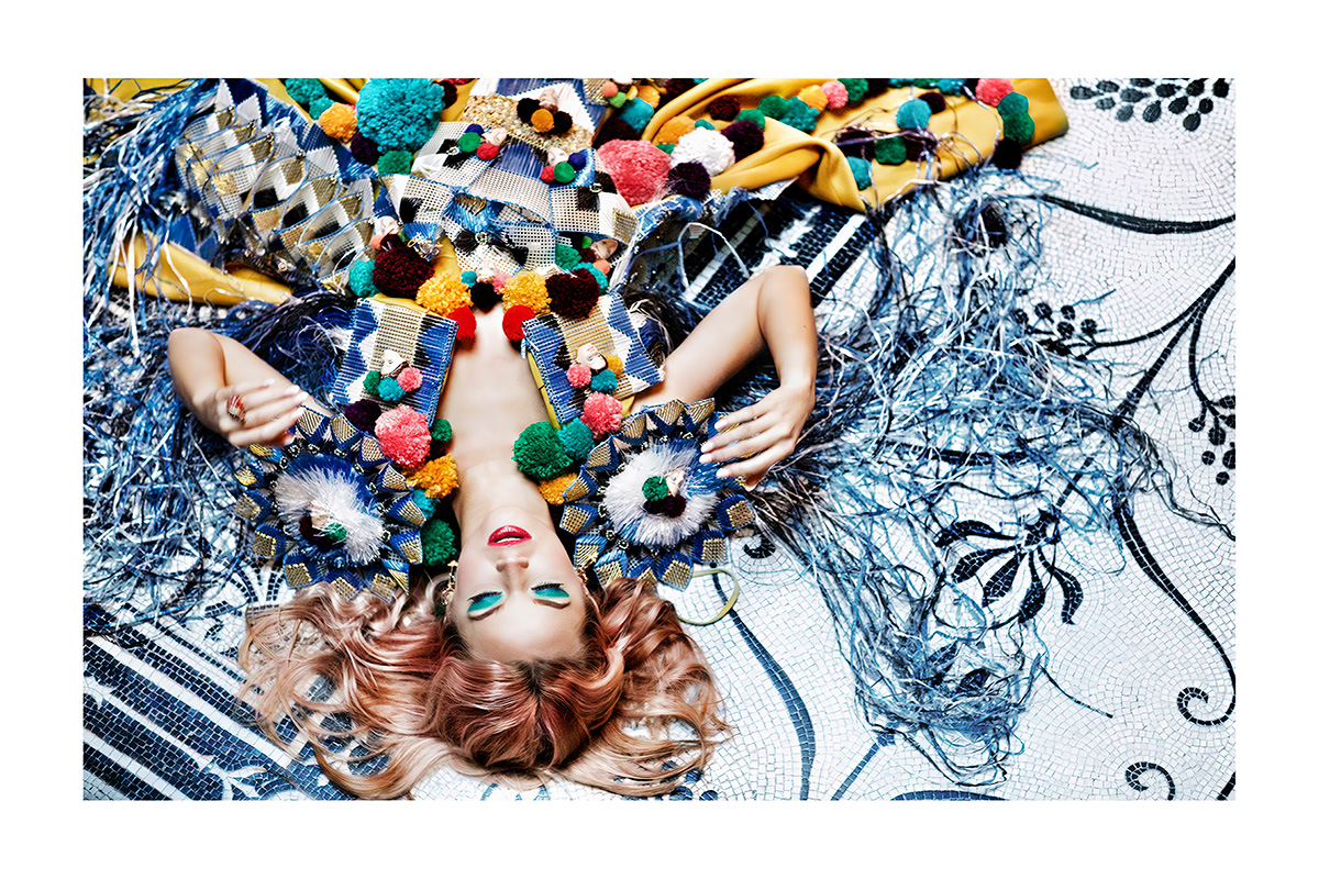 woman laying on colourful floor