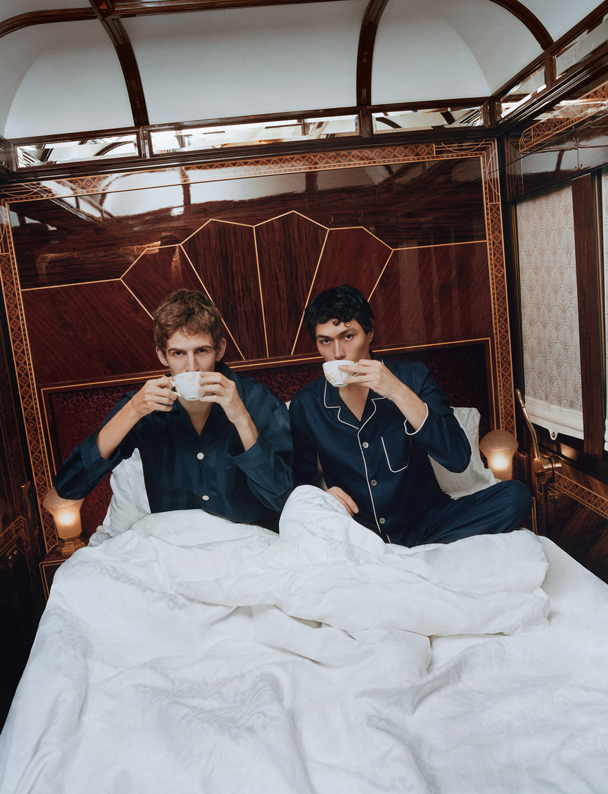 two boys in bed on train