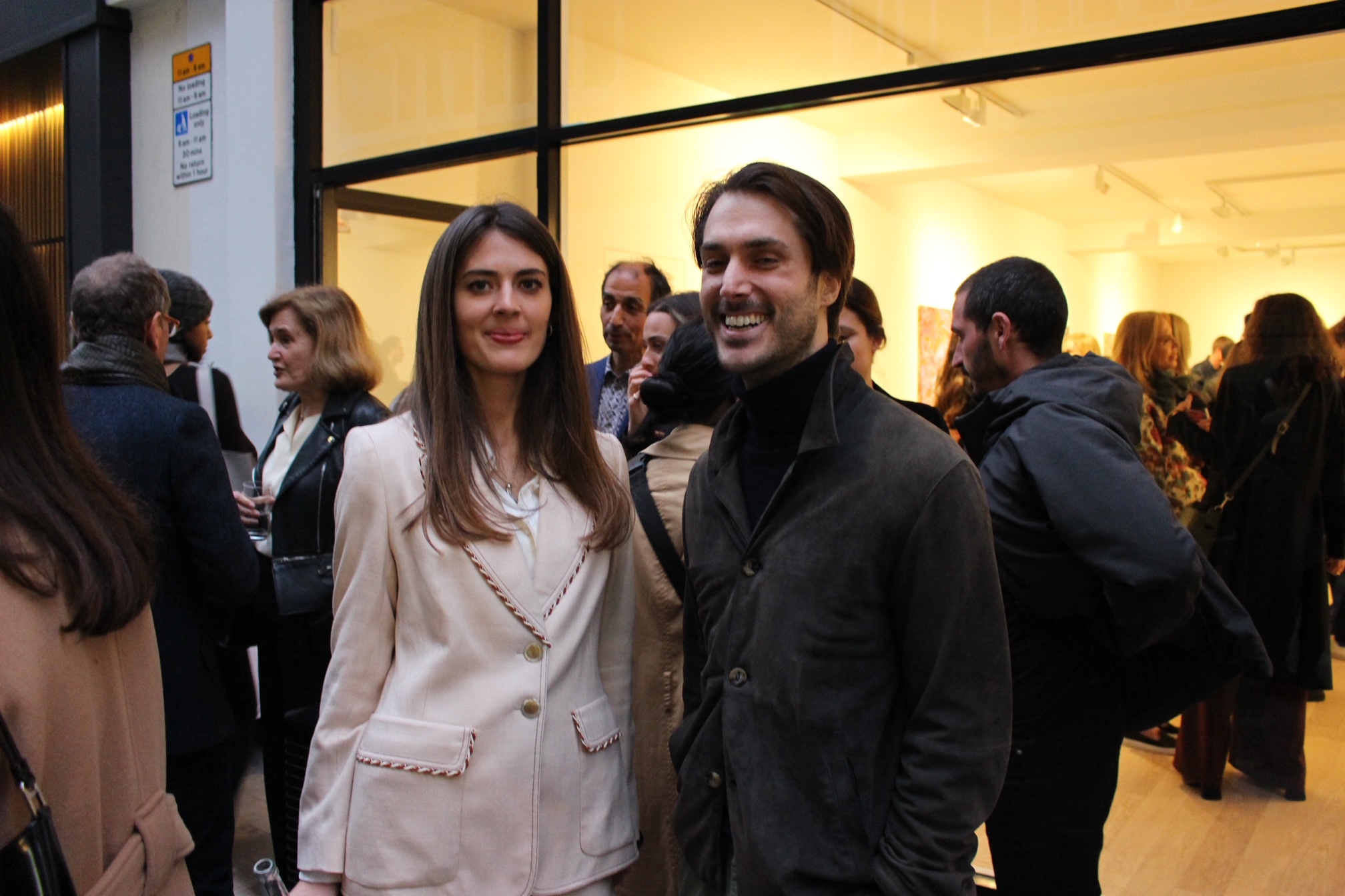 woman and man in front of an art gallery